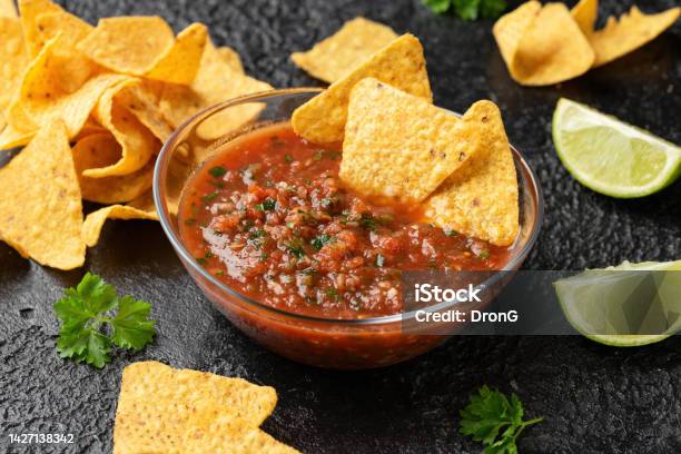 Mexican Tomato Salsa With Lime Onion Jalapeno Pepper Parsley And Tortilla Chips Stock Photo - Download Image Now