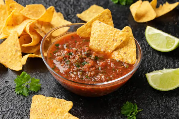 Photo of Mexican Tomato Salsa with lime, onion, jalapeno pepper, parsley and tortilla chips