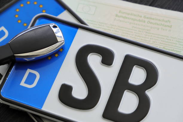 License plate with a car key stock photo