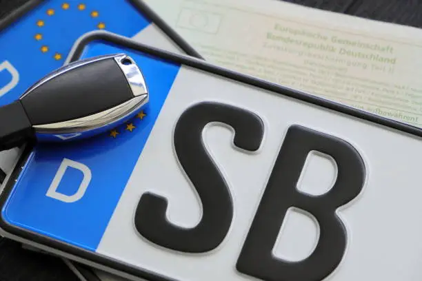 an EU license plate with registration and car keys from Saarland, Saarbruecken