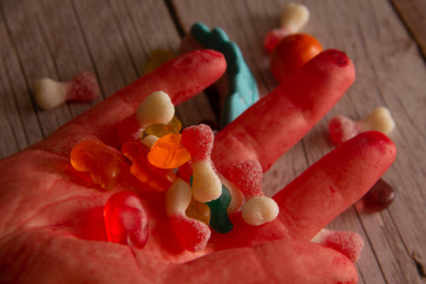 istock Bloody hand with Halloween candy. Selective focus. Copy space. 1427144118