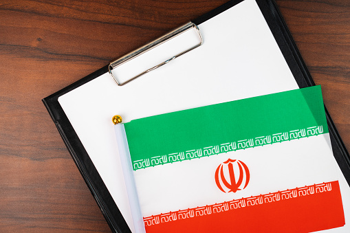 mockup for text on clipboard with Iranian flag, white sheet of paper in a folder for notes
