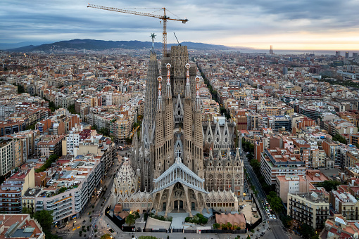 Sunrise drone aerial of the Basilica Sagrada Familia in Barcelona, Spain