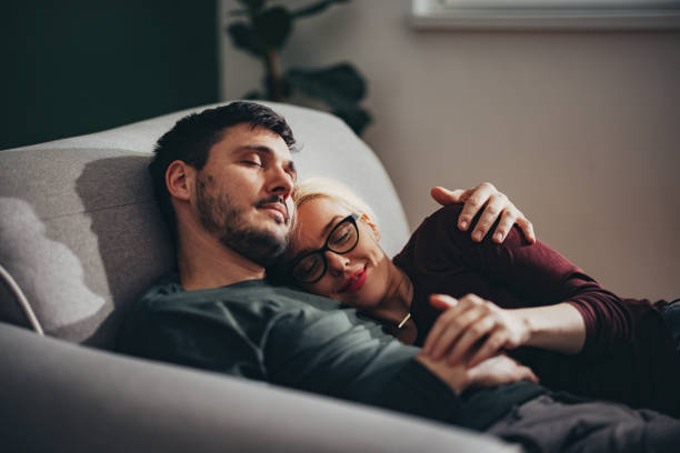 istock Loving Couple Napping Together on a Sofa at Home 1427145604