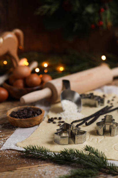 istock Baking Christmas cookies in rustic kitchen with cookie cutters and dough 1427185440