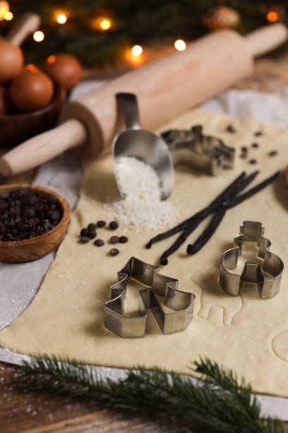 istock Baking Christmas cookies in rustic kitchen with cookie cutters and dough 1427185441