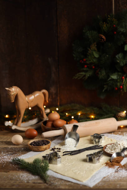 istock Baking Christmas cookies in rustic kitchen with cookie cutters and dough 1427186090