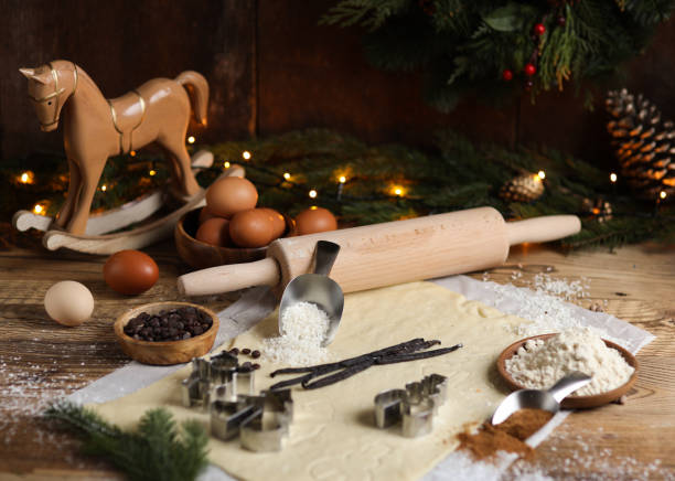 istock Baking Christmas cookies in rustic kitchen with cookie cutters and dough 1427186725