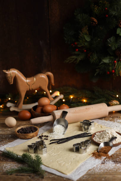 istock Baking Christmas cookies in rustic kitchen with cookie cutters and dough 1427186734