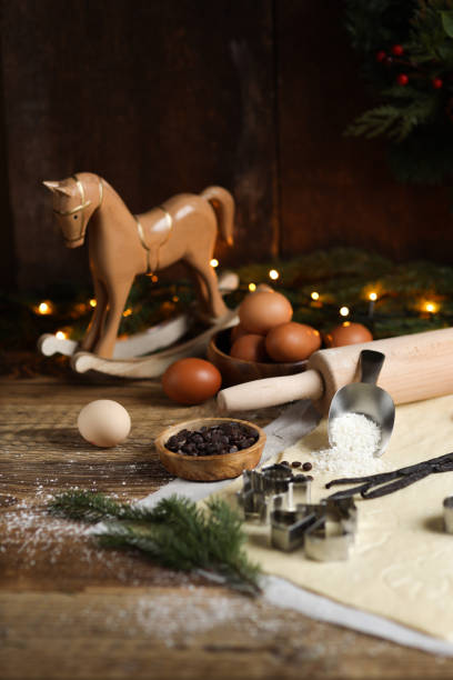 istock Baking Christmas cookies in rustic kitchen with cookie cutters and dough 1427187255