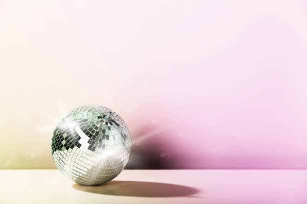 istock Disco ball on vintage styled background. Minimalistic stylish concept. 1427191702
