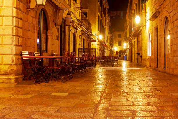 Old town illuminated street . Medieval city in the night