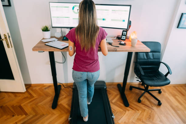 istock Standing desk home office with under desk treadmill 1427203559