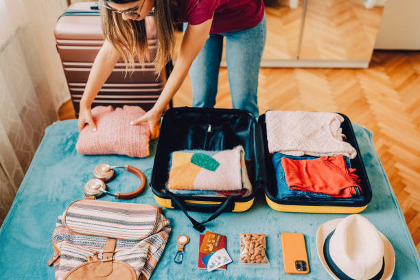 istock Woman packing suitcase for travel 1427204096