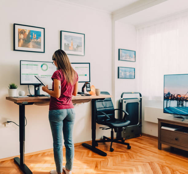 istock Woman with diabetes working at standing desk 1427204177