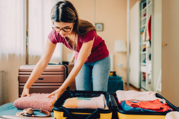 istock Woman packing suitcase for travel 1427204326
