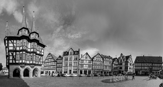 Alsfeld, Germany - June 25, 2021: famous town hall and half timbered historic houses at central square in Alsfeld, germany.