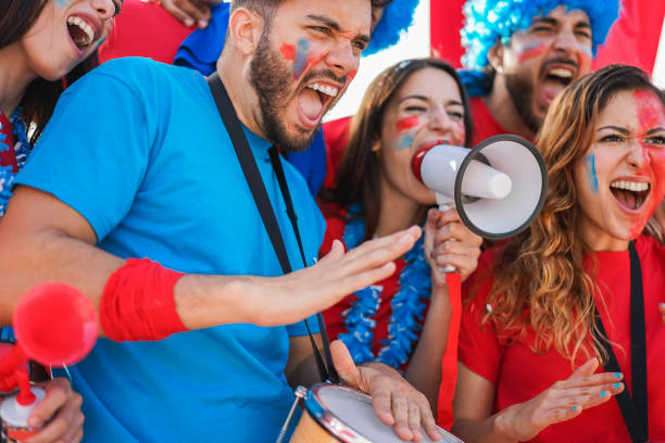 istock Crazy sport fans screaming while supporting their team - Focus on left man face 1427207962