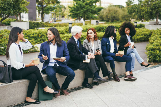 istock Diverse business people doing lunch break outdoor from office building 1427208322