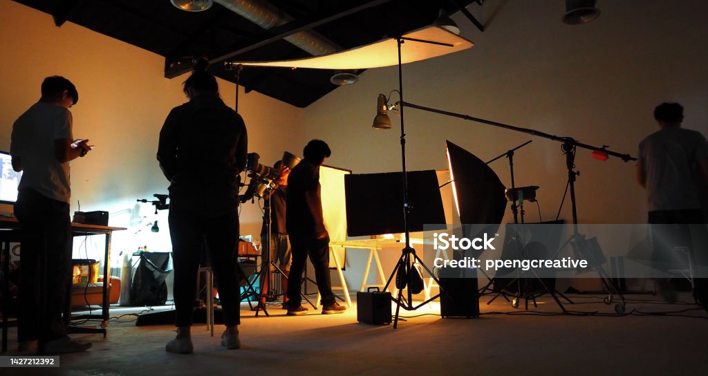 Production team shooting some video movie for tv commercial with studio equipment set. Movie Stock Photo