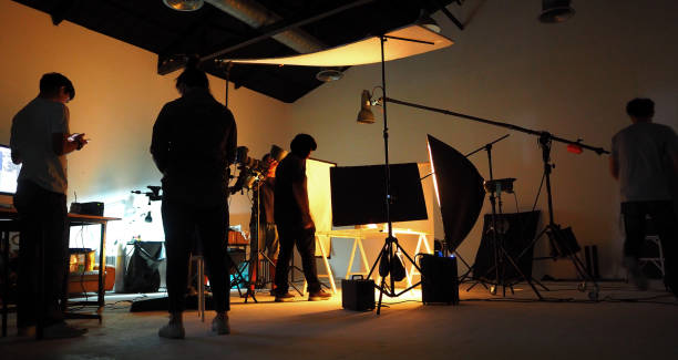 production team shooting some video movie for tv commercial with studio equipment set. - indústria cinematográfica imagens e fotografias de stock