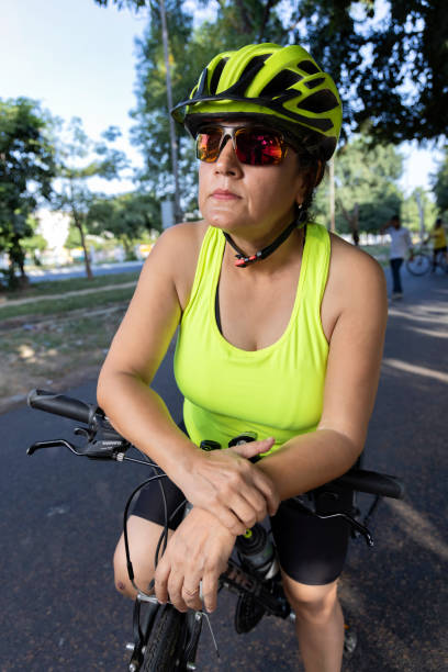 istock Thoughtful old woman leaning on bicycle with water bottle 1427213288