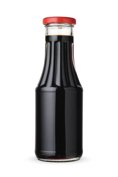 istock Narsharab pomegranate sauce in the glass bottle isolated. 1427214147