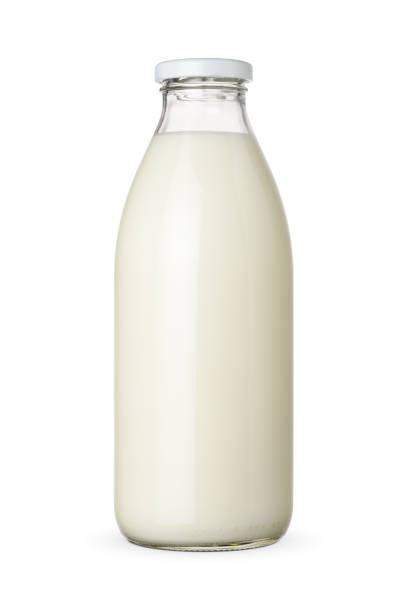 istock Classic glass milk bottle isolated on a white background. 1427214172
