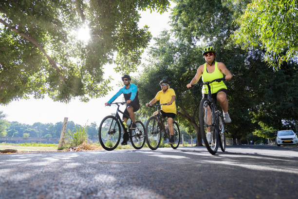 istock Friends cycling on countryside road 1427214219