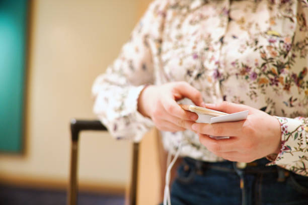 istock Woman doing Online Check-in using mobile phone 1427216959