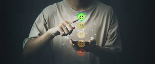 istock Customer service evaluation and satisfaction. Man hand touching good smile rating with smartphone. Feedback survey concept. 1427218854
