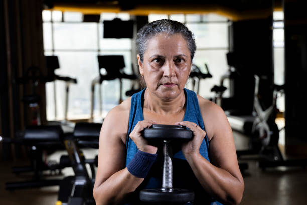 Woman lifting weights at the gym