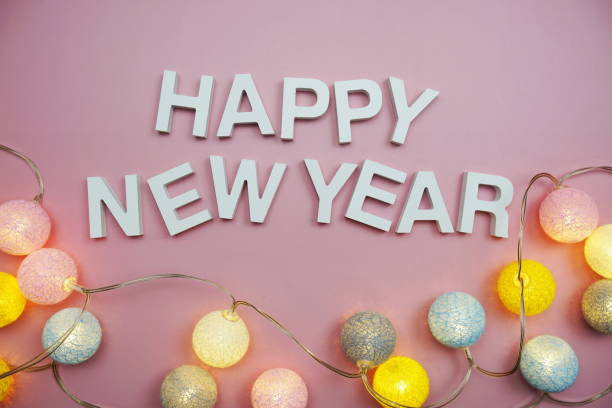 istock Happy New Year alphabet letters on pink background 1427220949