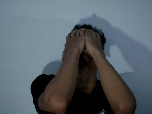 istock Front view of a man holding his head showing stress gesture 1427221475