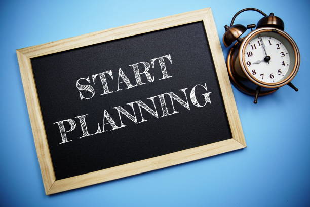 istock Start Planning word on Blackboard and alarm clock on blue background 1427221827