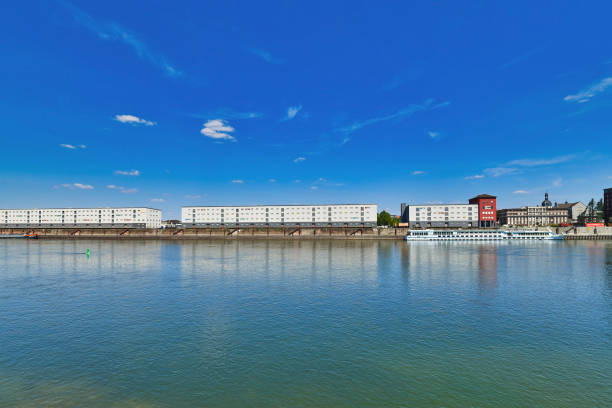 Ludwigshafen, Germany - August 2022: View from Ludwigshafen at Rhine river and 'Graeff Spedition' transport company buildings in Mannheim city