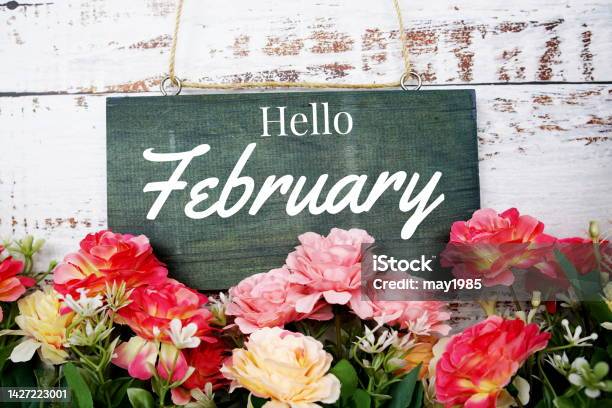 Hello February Typography Text Decorate With Flower On Wooden Background Stock Photo - Download Image Now