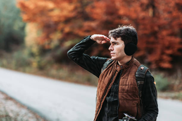 Young man hiker looking at something in the distance