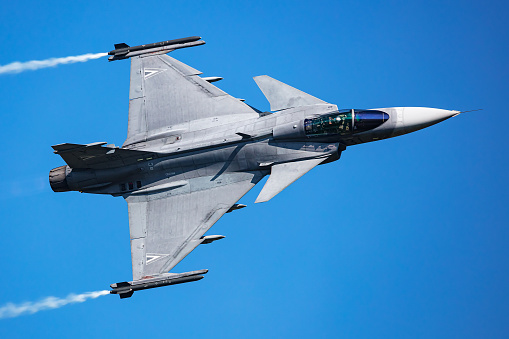 Zeltweg, Austria - September 3, 2022: Hungarian Air Force SAAB JAS 39 Gripen. Military fighter jet plane at air base. Flight operation. Aviation and aircraft. Air defense. Fly and flying.