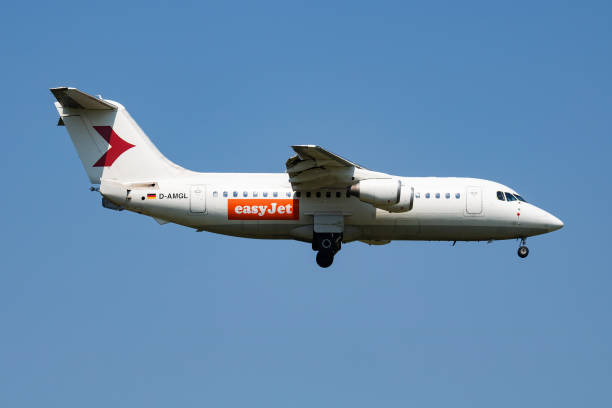 EasyJet British Aerospace Avro RJ100 D-AMGL passenger plane arrival and landing at Vienna Airport Vienna, Austria - May 13, 2018: EasyJet British Aerospace Avro RJ100 D-AMGL passenger plane arrival and landing at Vienna Airport british aerospace stock pictures, royalty-free photos & images