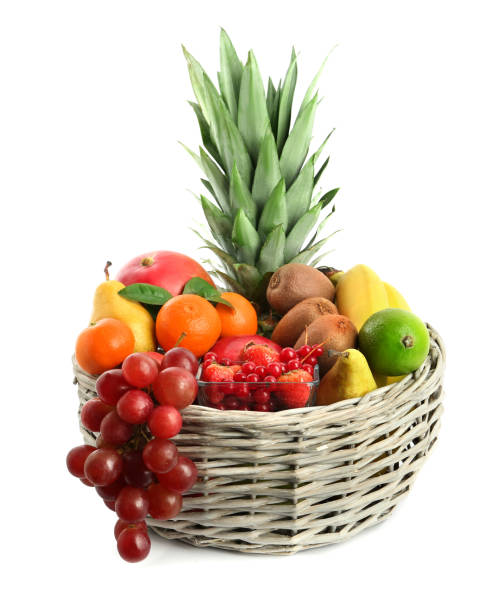 istock Wicker basket with different fresh fruits isolated on white 1427234745