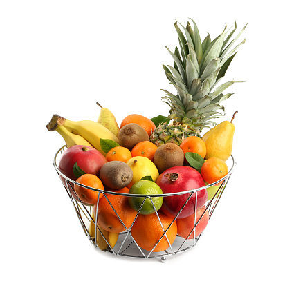 Metal bowl with different fresh fruits isolated on white