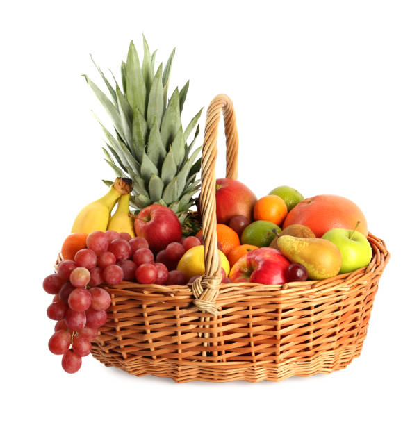 istock Wicker basket with different fresh fruits isolated on white 1427234900