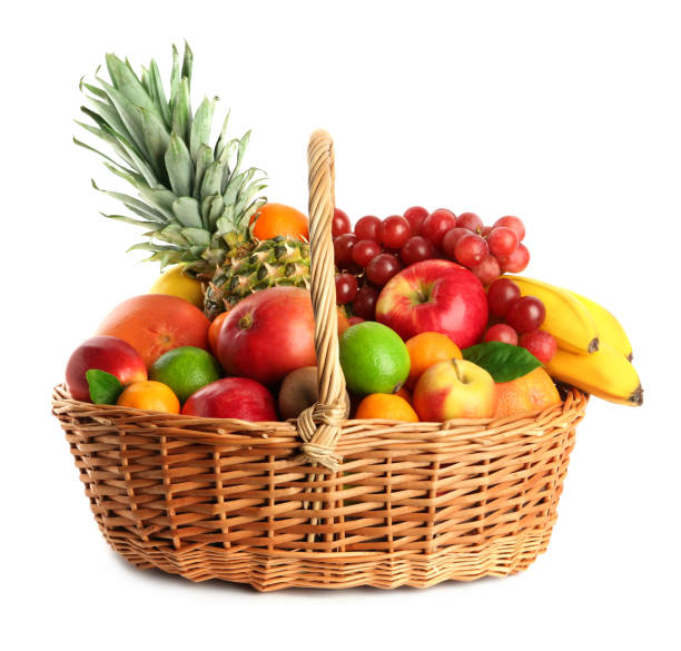 istock Wicker basket with different fresh fruits isolated on white 1427234959