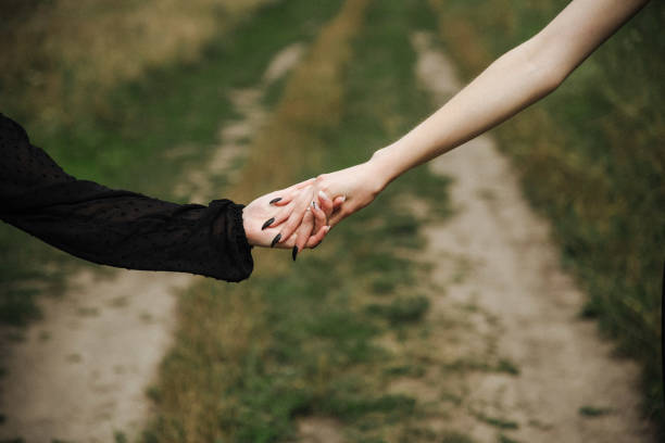 istock two girls are holding hands 1427236871