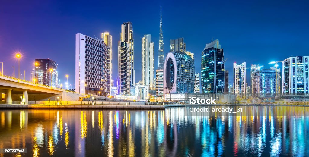 Dubai city colorful skyline at night, UAE Dubai Business Bay area and night city scenic skyline, United Arab Emirates Dubai Stock Photo