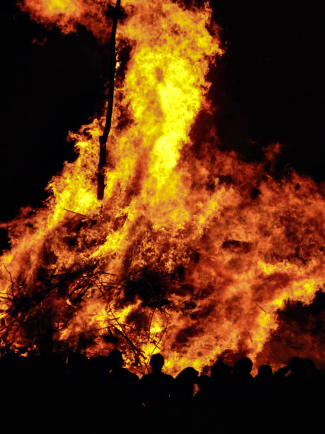 istock Silhouette of people watching a big bonfire 1427238118