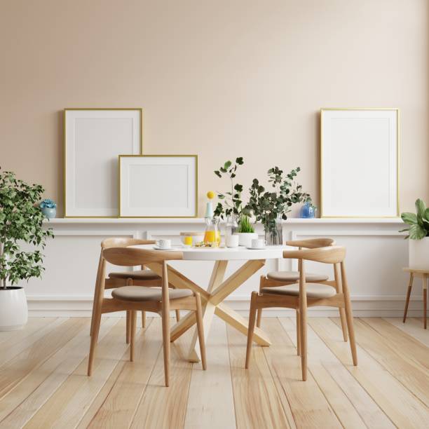 istock Mock up poster in modern dining room interior design with cream color empty wall. 1427241104