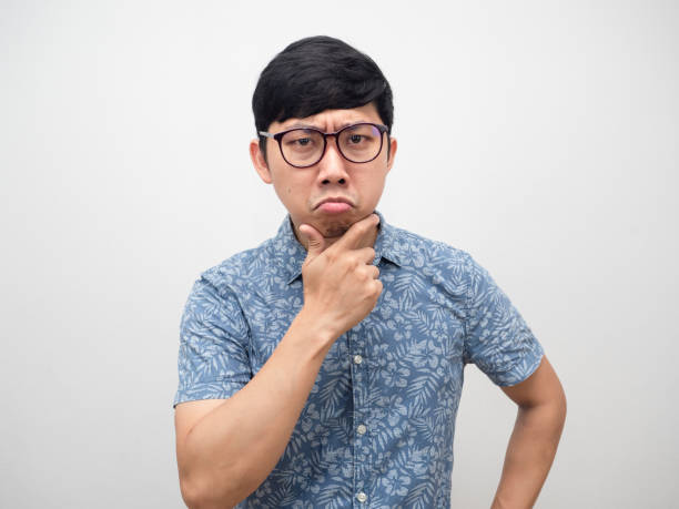 istock Confused young man glasses thoughtful about something isolated 1427241261