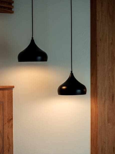 istock Twin ceiling lighting in the dark room. Two hanging lamp or round ceiling lamp decorated as a steps on white and wood wall, vertical style. 1427243377